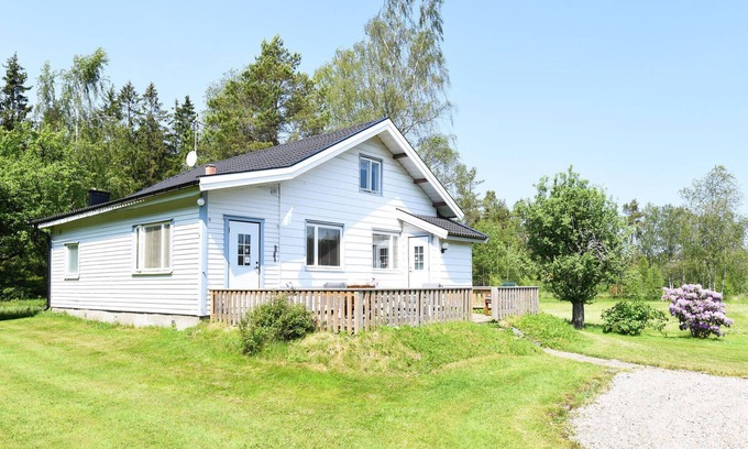 Trollhattan House | Inviting Cottage Retreat by the Forest with Stunning Lake View