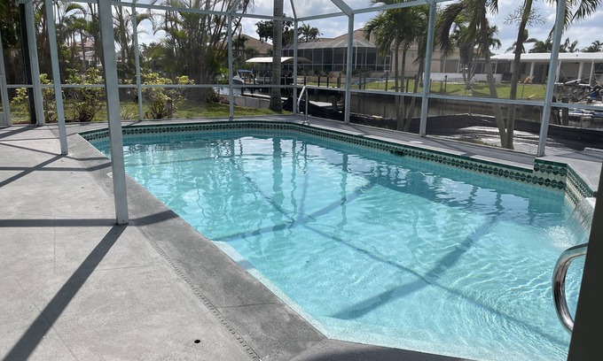 Yacht Club House | Elegant 3BR Canal Retreat with Heated Pool & Ocean Views