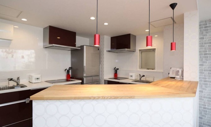 Kita Ward Apartment | Convenient Hostel Steps from Okayama Station with Spa