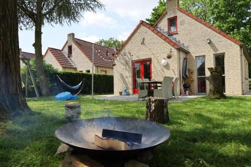 Ewijk House | Family-Friendly Retreat with Firepit, Garden & Swimming Lake