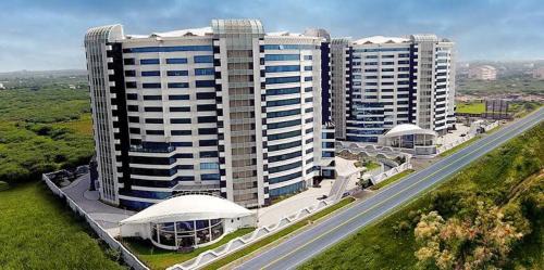 Dumas Apartment | Weekend Retreat at Rajhans Belliza with Oceanfront Pool