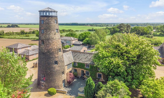 Stoke Ferry House | Pet-Friendly 7 Storey Windmill with Pool & BBQ Amenities