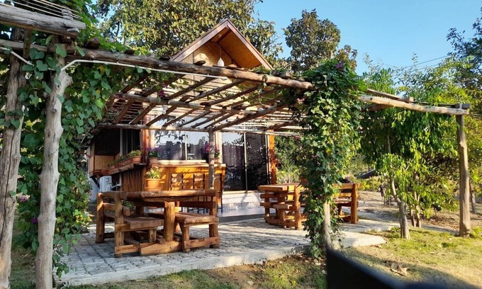 Huai Sai House | Inviting Bungalow with Kitchen in Serene Countryside