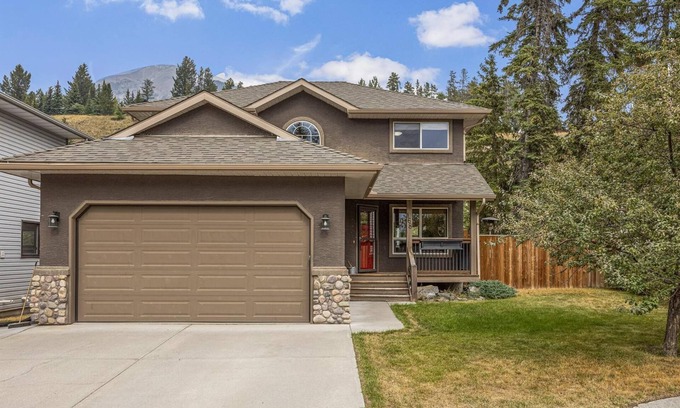 Cougar Creek House | Inviting Family Retreat with Pool and Spa in Canmore