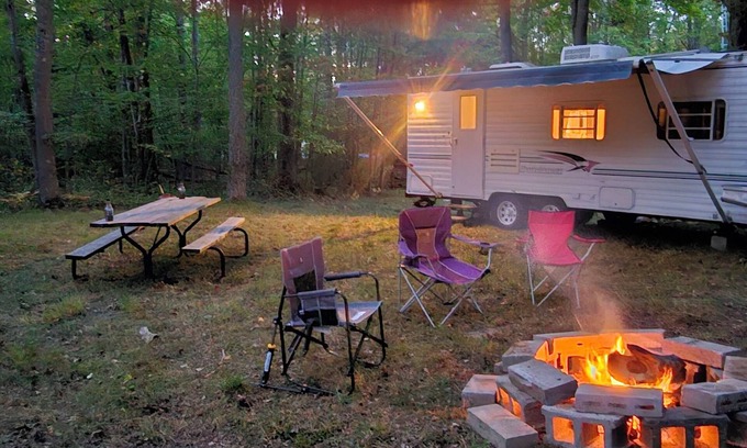 Grayling House | A well-maintained, vintage camper in a secluded location near state land