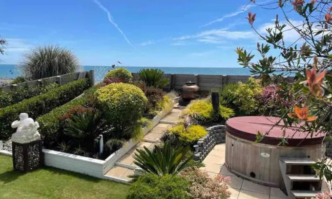 Ruby Bay House | Beachfront Haven: Sea Views, Hot Tub & Top Guest Rating