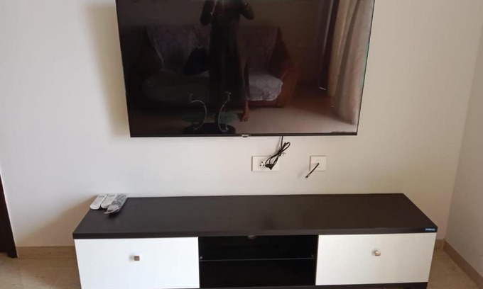Kadadhe Apartment | Cozy 1BHK Flat with Highway View in Lodha Belmondo, Pune
