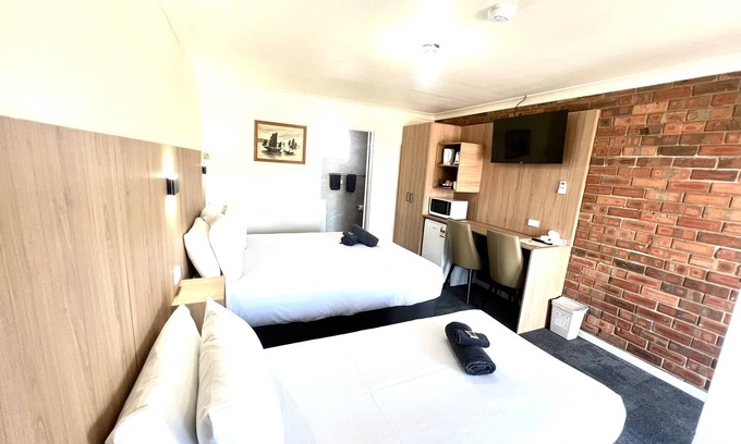 Forbes Hotel | Budget-Friendly Stay at Adrian Motel with Pool & Kitchen