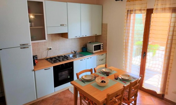 La Muddizza Apartment | Pet-Friendly Retreat with Pool at Affittimoderni Valledoria