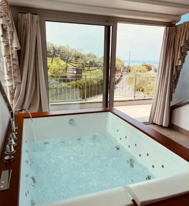 Rezza Apartment | Oceanfront Relaxation at AGRI SUITE View - La Bilaia