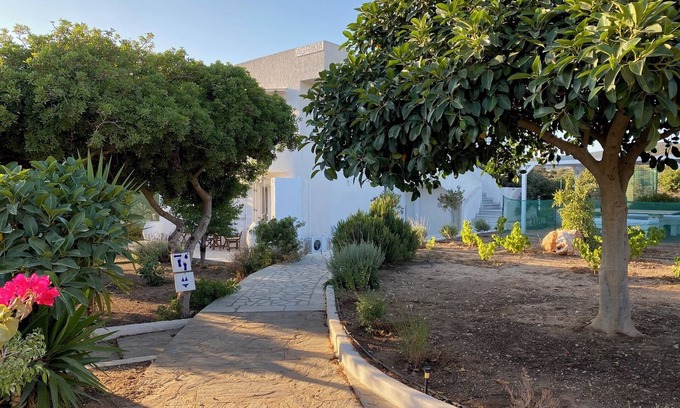 Aliki Apartment | Experience Agrikia Apartments: Garden Oasis near Beaches