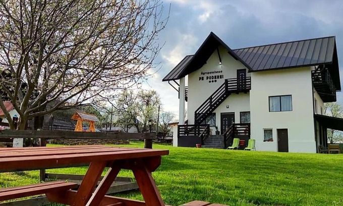 Cupseni Villa | Discover Agropensiunea Pe Poderei with Cozy Fireplace