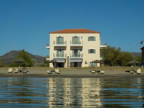 Karvelas Apartment | Beachfront Bliss at Akti Kamares - 4-Star Guest Favorite