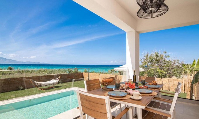 Alikanas Villa | Elegant Aktis Villa: Oceanfront Retreat with High Ratings