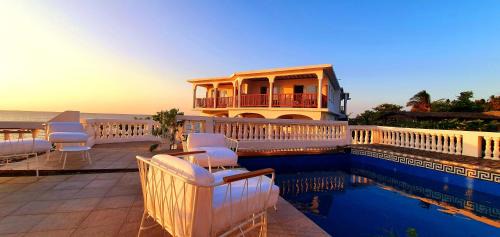 Ngazidja Cabin | Experience Al Camar Lodge: Oceanfront Escape with Pool