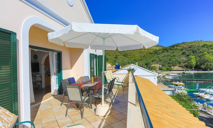 Agios Stefanos Apartment | Experience Alexandra Bay Front: Ocean Views & Premium Amenities