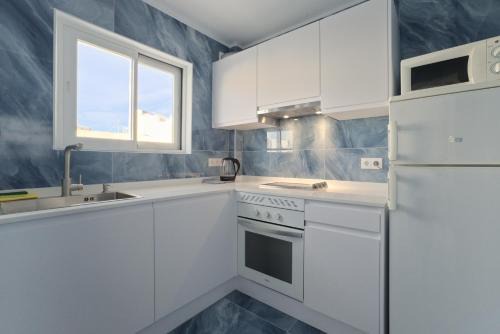 Sant Antoni de Portmany Apartment | Relax at All Suite Ibiza Aparthotel with Oceanfront Views