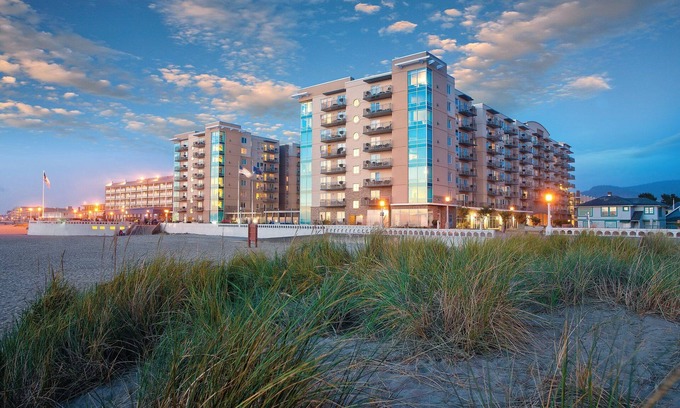 Seaside Gilbert District Resort | Home Away From Home: Poolside Relaxation and Ocean Views