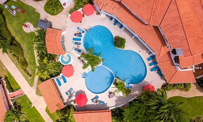 Maynards Hotel | Unwind at Heywood Beach: Outdoor Pools & Oceanfront Views