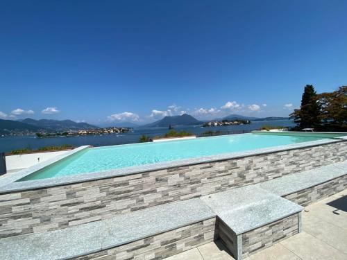 Carciano Apartment | Amadeus: Oceanview Retreat with Pool & Family-Friendly Perks
