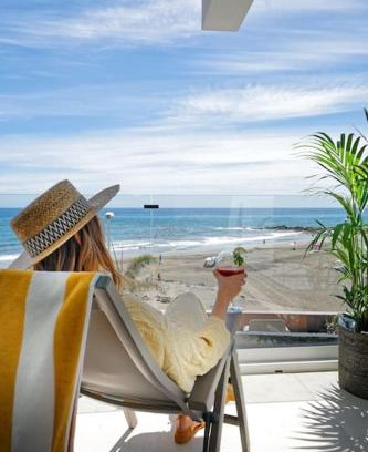 San Agustin Apartment | Beachfront Amapola Waves - Recently Renovated Retreat