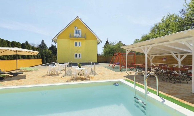 Balatonmariafurdo Apartment | Inviting Amarillo 2 with Oceanfront Pool and Spa Amenities