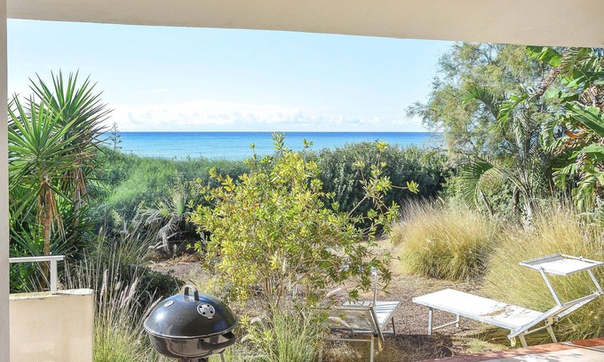 Punta Braccetto House | Unwind by the Water: Relaxing Garden Retreat with Spa