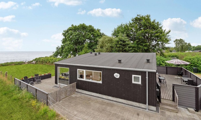 Grønninghoved Strand House | Cozy Oceanfront Cottage with Spectacular Views Await