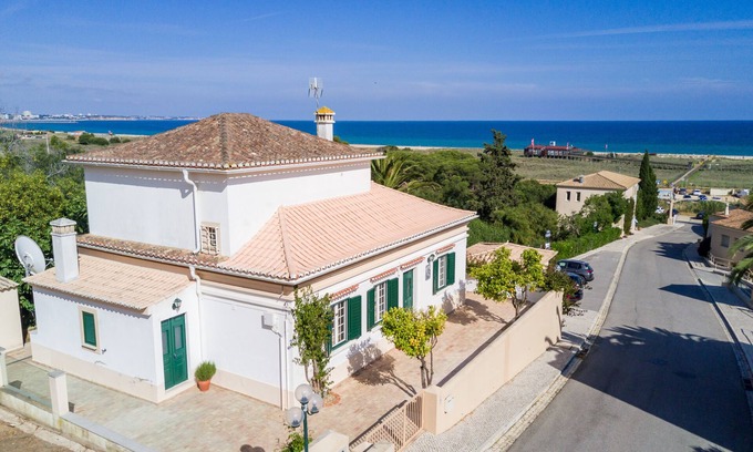 Meia Praia Villa | Beachside Villa Steps from Ocean with Spa & Family Amenities