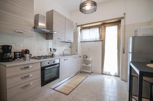 Cinecitta Apartment | Amber House N.5: Cozy and Bright Getaway for Families