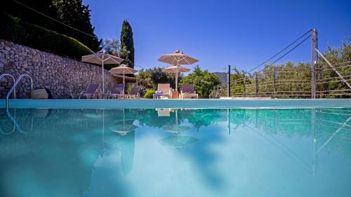 Perama Apartment | Experience AMD House: Oceanfront Retreat with Pool Access