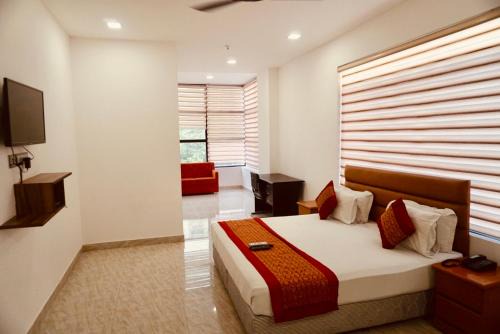 South West Hotel | Cozy Amora Rooms Dwarka: Ideal for Families & Accessible