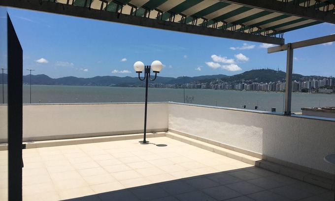 Estreito Apartment | Stylish Penthouse with Ocean View in Prime Waterfront Location