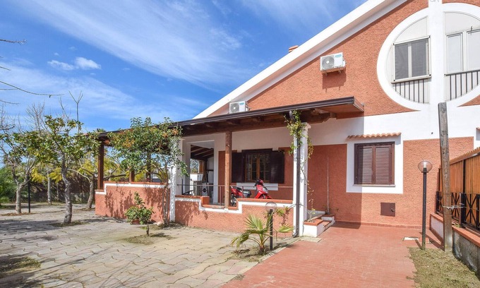Scalea House | Discover Sunlit Shores: Oceanfront Relaxation Awaits