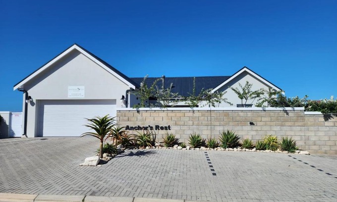Yzerfontein House | Relax at Anchor's Rest: Oceanfront Views & Cozy Fireplace