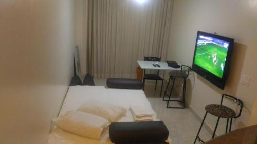 Triangulo das Bermudas Apartment | Ideal Stay at Apart Hotel Quartier Latin with Pool Access