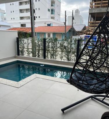 Governador Celso Ramos Apartment | Relax in a Poolside Apartment Steps from the Beach
