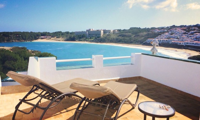 Arenal d'en Castell Apartment | Oceanfront Apartment with Pool and Stunning Sea Views