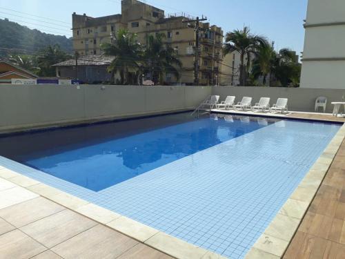 Vila Julia Apartment | Beachside Retreat with Ocean View and Pool at Guarujá