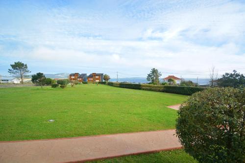 Corrubedo Apartment | Oasis Retreat: Apartment with Garden Near Corrubedo Beach