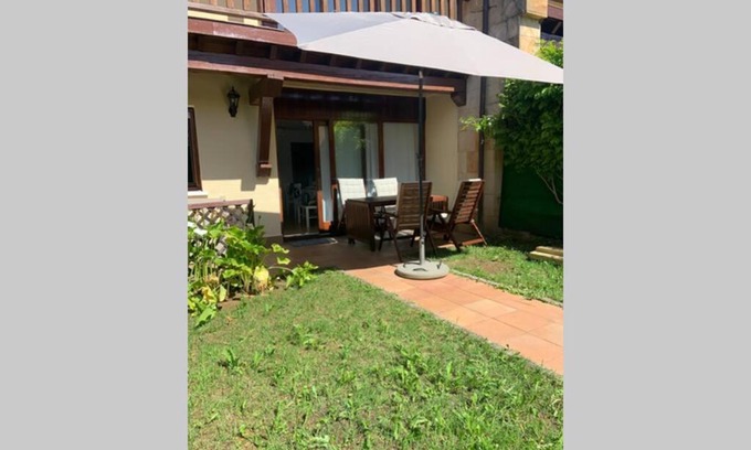 Comillas Apartment | Delightful Apartment with Private Garden and Ocean View