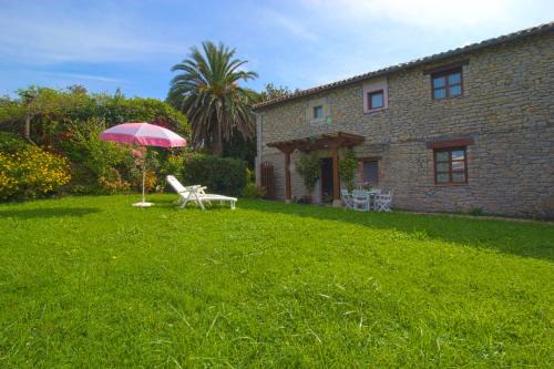 Suances Apartment | Beautiful La Ermita Apartment with Oceanfront Garden Views