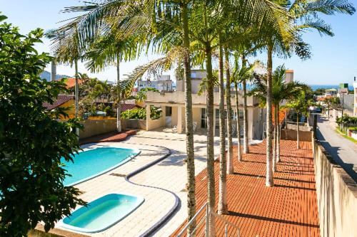 Santinho Apartment | Oceanfront Escape at Apartamento Santinho - Rated 10/10