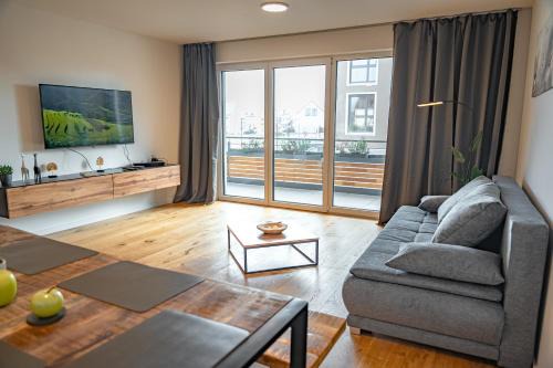 Eching Apartment | ApartHome: Serene Oceanfront Stay with Balcony Retreat