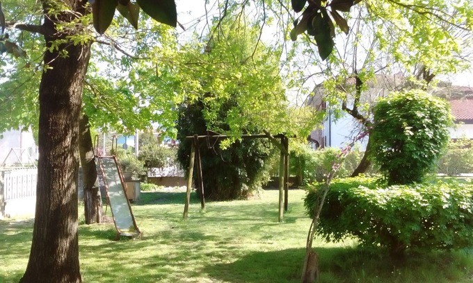 Noventa di Piave Apartment | Inviting Apartment with Garden Near Venice for 1-9 Guests