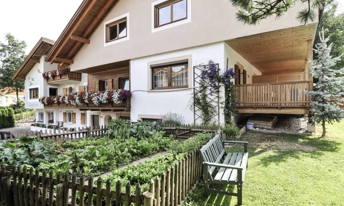 Siusi Apartment | Mountain View Apartment "Bergfrieden 2 B" with Pool & Garden