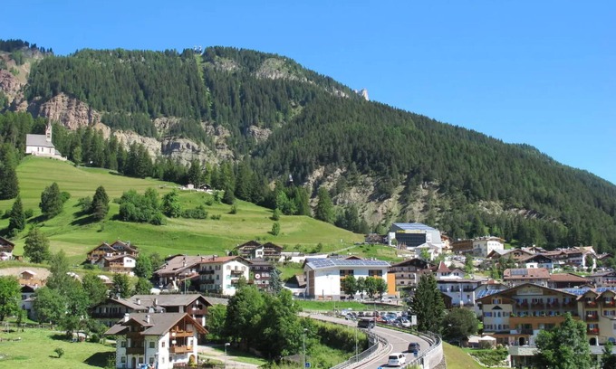 Vigo di Fassa Apartment | Discover 'Casa Delmarco': Private Terrace & Garden Oasis