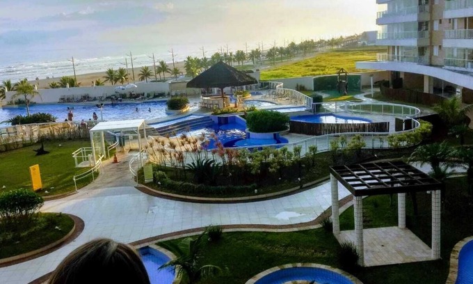 Mirim Apartment | Beachfront Apartment with Balcony and Pool Access