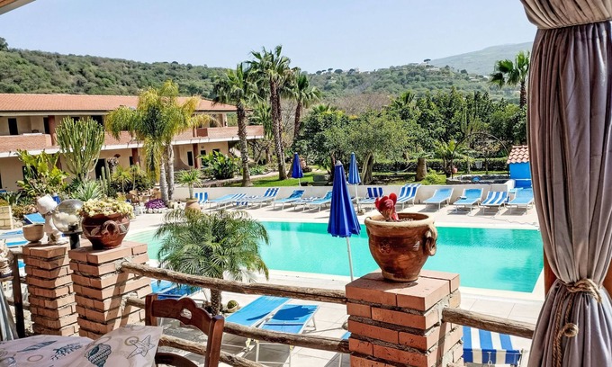 Ricadi Apartment | Oceanfront Apartment Heaven: Pet Friendly & Spa Amenities
