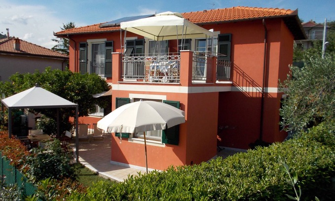 Carozzo Apartment | Inviting Villa Apartment with Sea View and Family-Friendly Perks